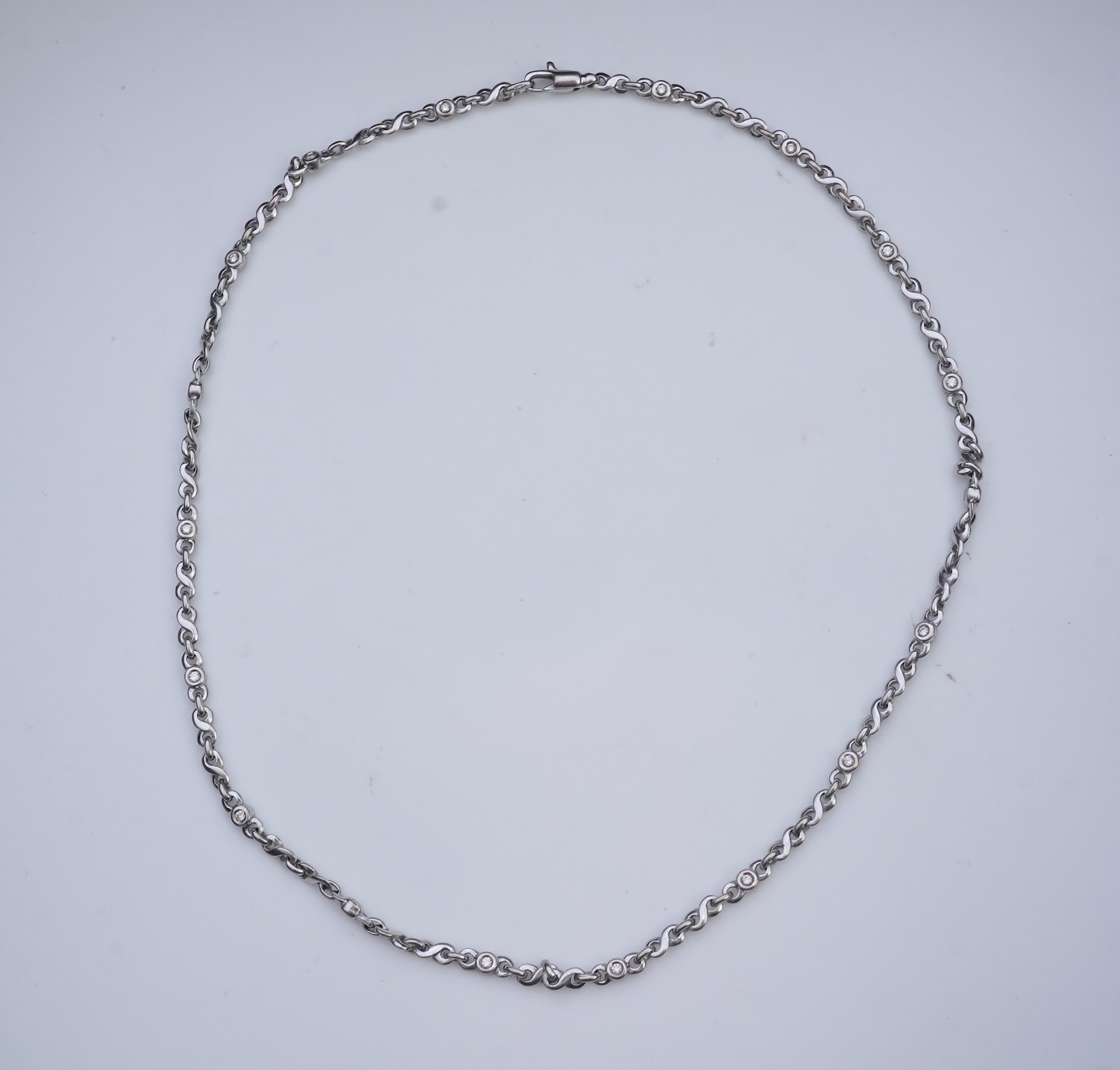 A white gold and diamond necklace